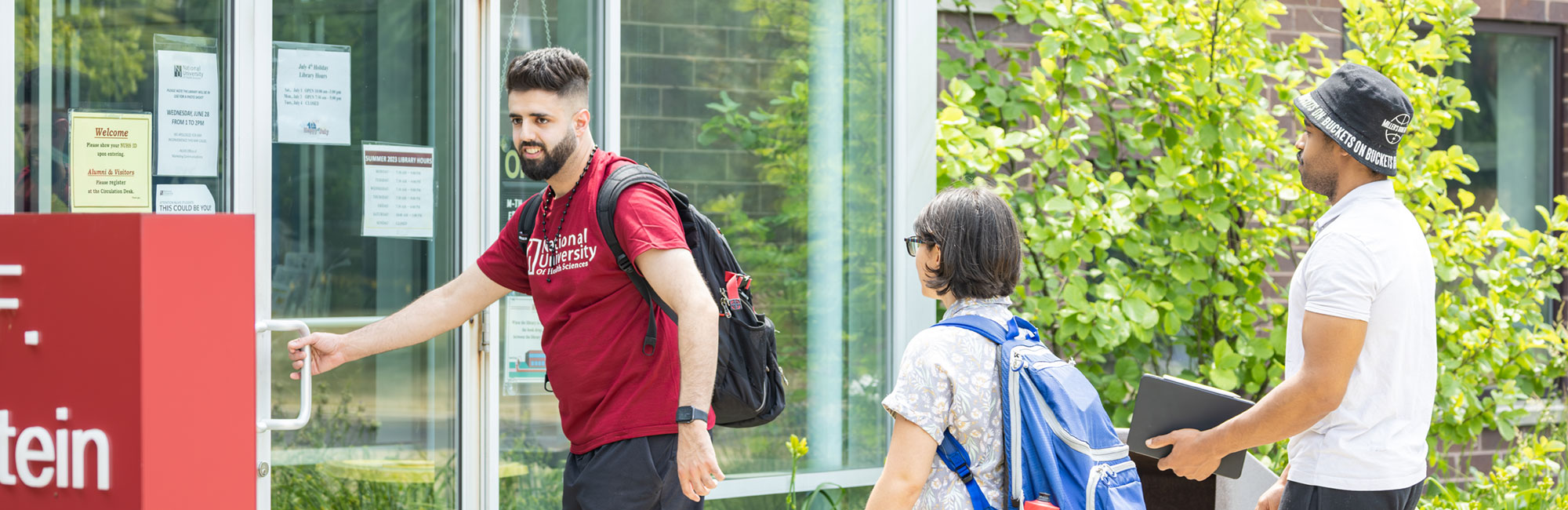 students walking into the library