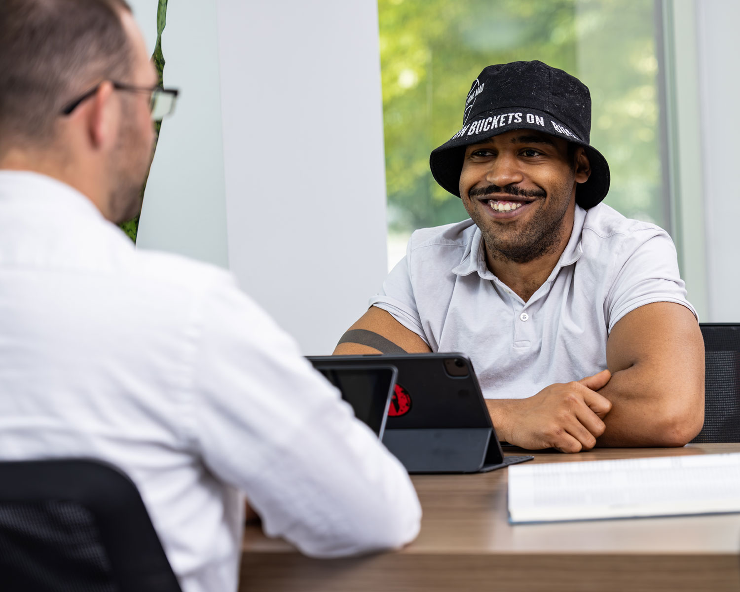 male students working at a library table