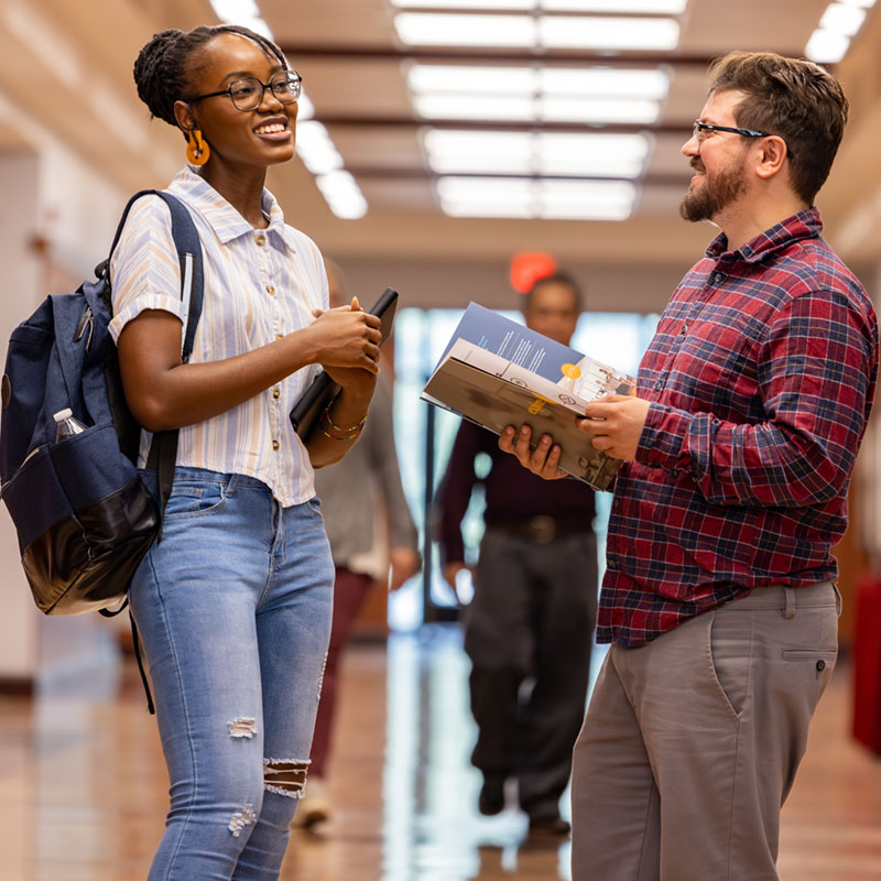 student showing a prospective student janse hallway