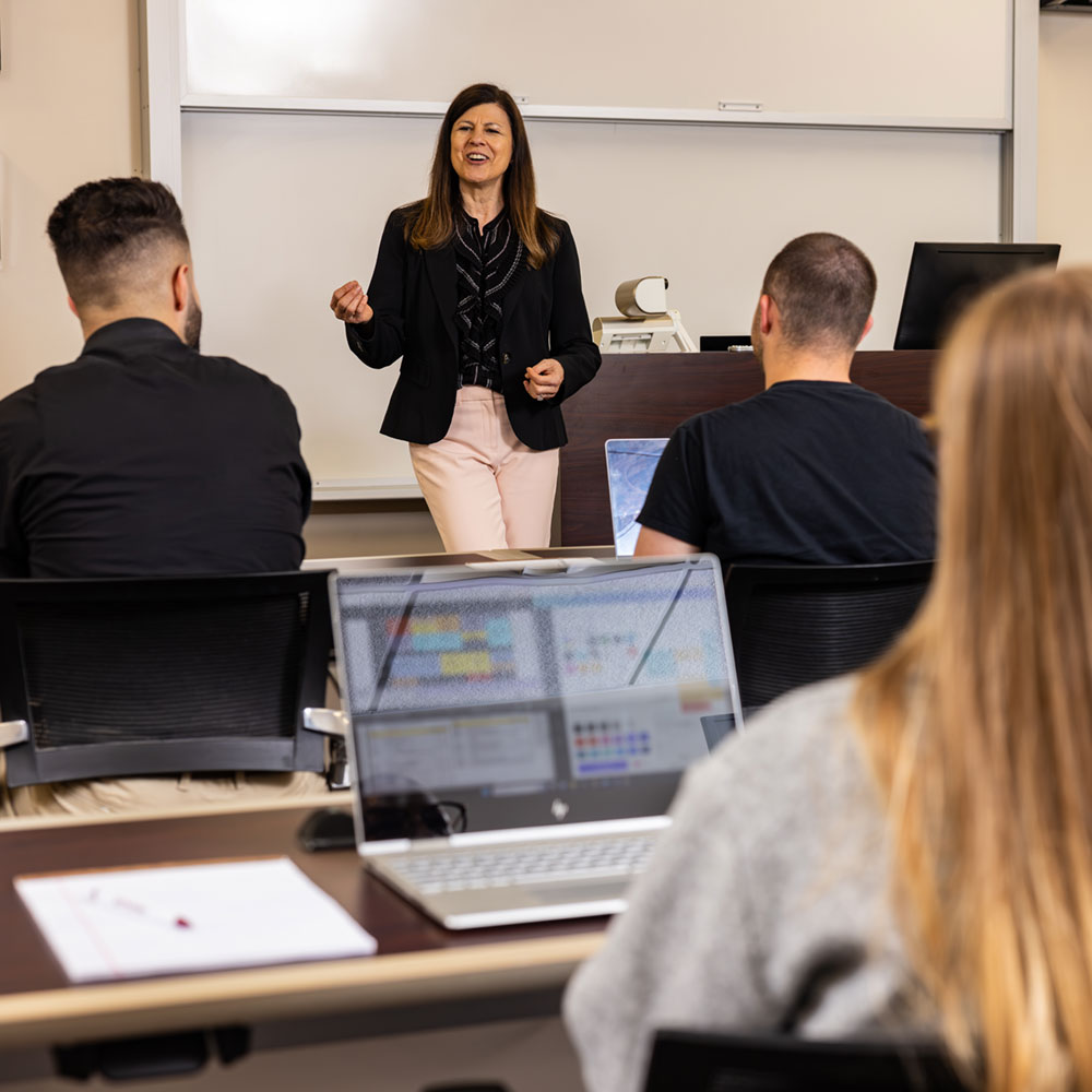 teacher at front of class of students