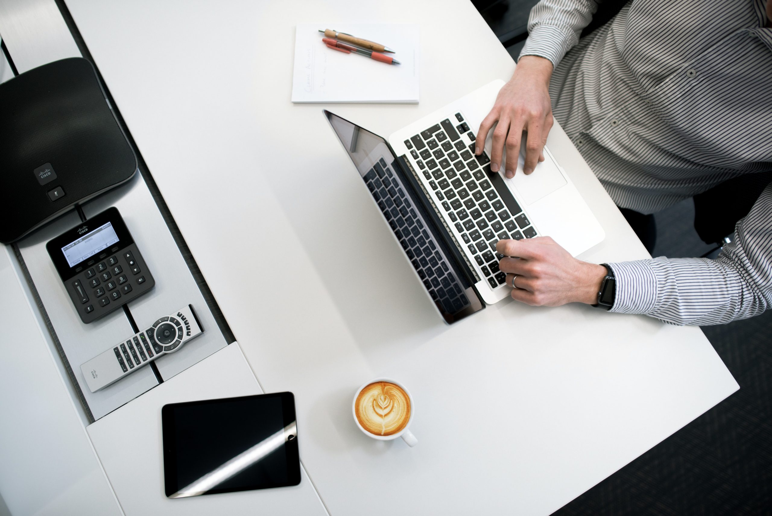 overhead view of student at desk on laptop