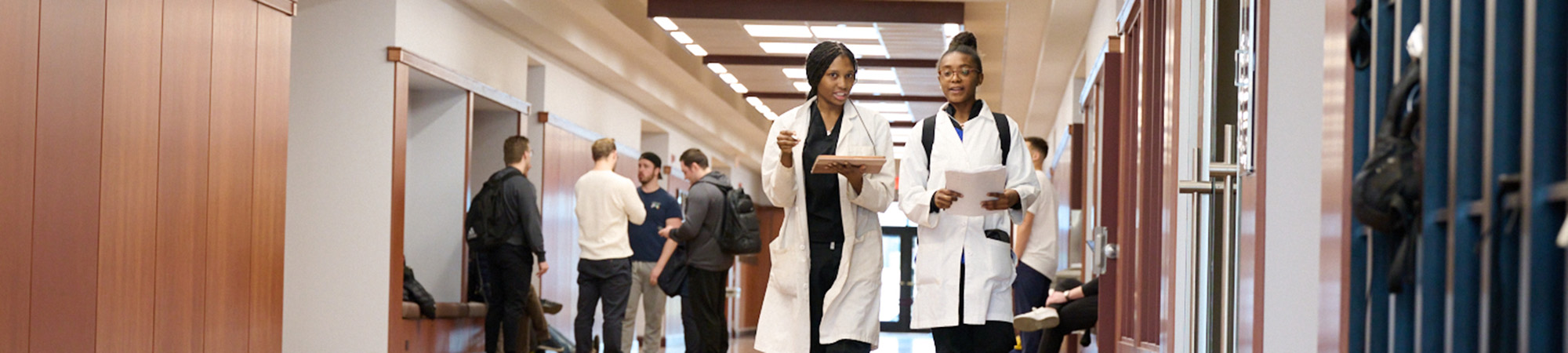 students walking in janse hallway